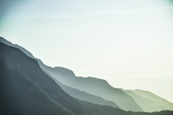 Lake Reflections - A serene view of misty mountain layers in Schwaz #1054222