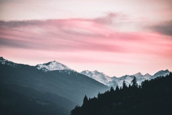 Mountain Landscapes - Captivating sunset over snow-capped peaks in Jen #1054289