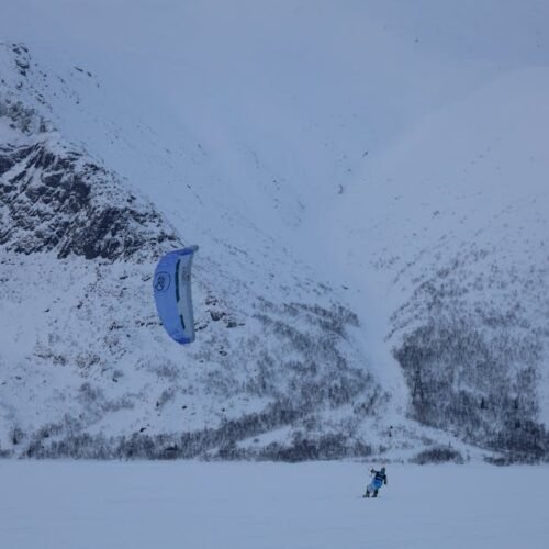 Snow Mountains - A thrilling snowkiting experience against the sn #11302800