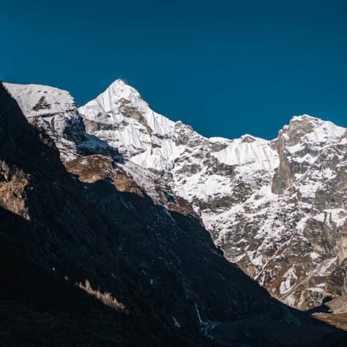 Mountain Landscapes - Captivating view of snow-covered mountain peaks  #12495915