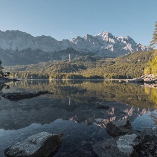 Snow Mountains - Scenic view of Zugspitze and Eibsee with reflect #12568084