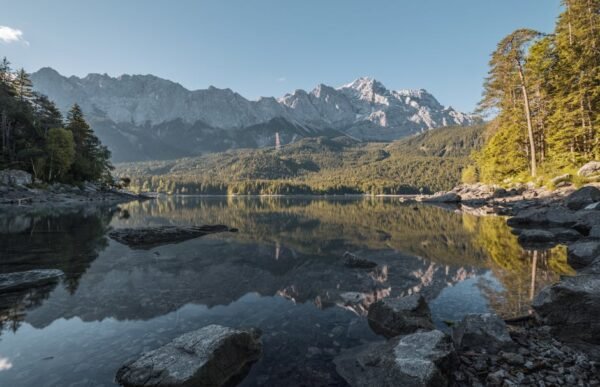 Snow Mountains - Scenic view of Zugspitze and Eibsee with reflect #12568084