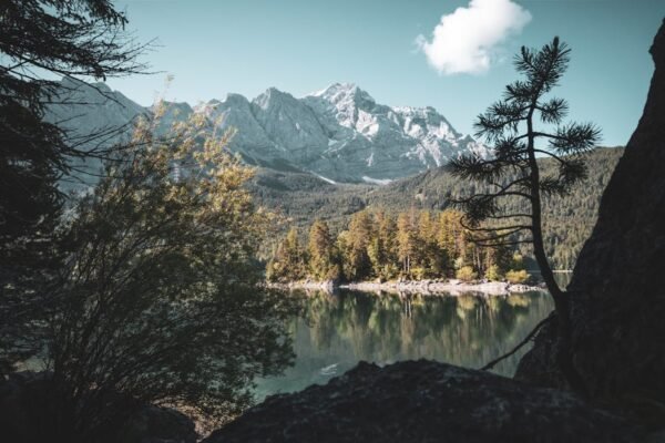Mountain Landscapes - Breathtaking view of Zugspitze and Eibsee reflec #12568085