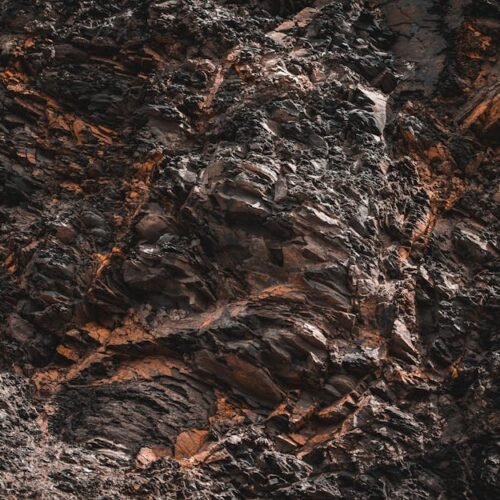 Desert Wilderness - Close-up of jagged, textured natural rock format #12918473