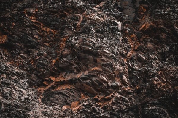 Desert Wilderness - Close-up of jagged, textured natural rock format #12918473