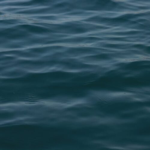 Beach Scenery - Calm and serene ocean waves at Alghero, Sardinia #13319488