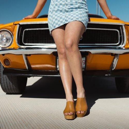 Desert Wilderness - A woman in a miniskirt poses in front of an oran #16259519 Desert Wilderness - A woman in a miniskirt poses in front of an oran #16259519