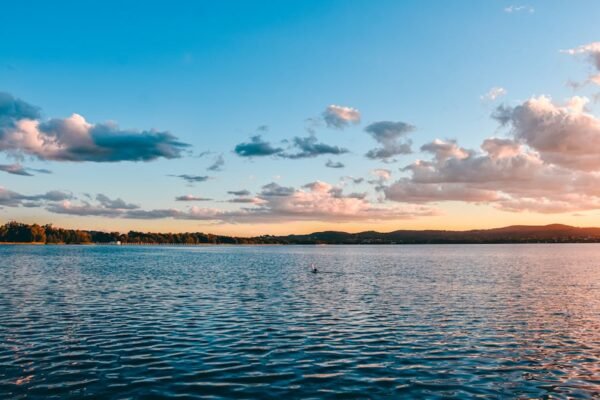 Lake Reflections - Peaceful sunset over a lake with clouds reflecti #16354056