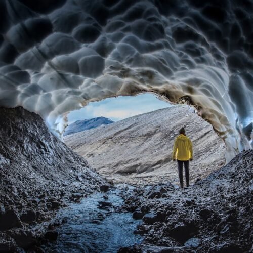 Beach Scenery - A person in a yellow jacket stands at the entran #17366843