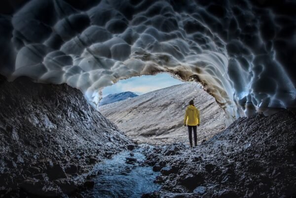 Beach Scenery - A person in a yellow jacket stands at the entran #17366843