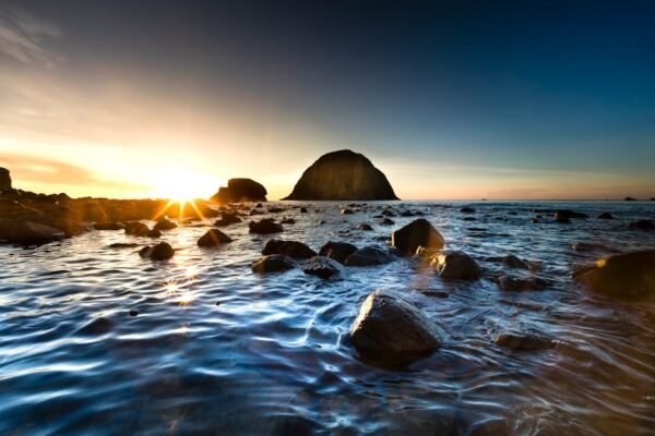 Beach Scenery - Peaceful sunrise over a rocky shoreline with cal #2163074
