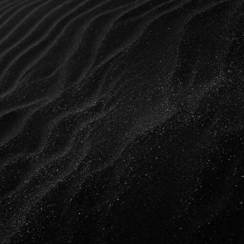 Lake Reflections - Textured black sand with ripples resembling dune #2387793
