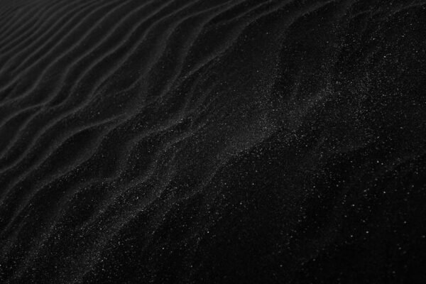 Lake Reflections - Textured black sand with ripples resembling dune #2387793