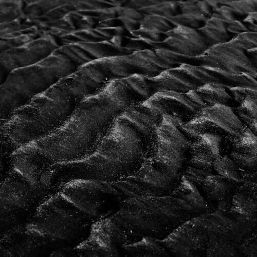 Desert Wilderness - Close-up of textured black sand dunes in monochr #2387818