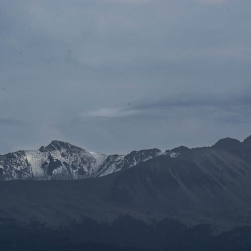 Snow Mountains - A stunning snow-capped mountain range under dark #2422239