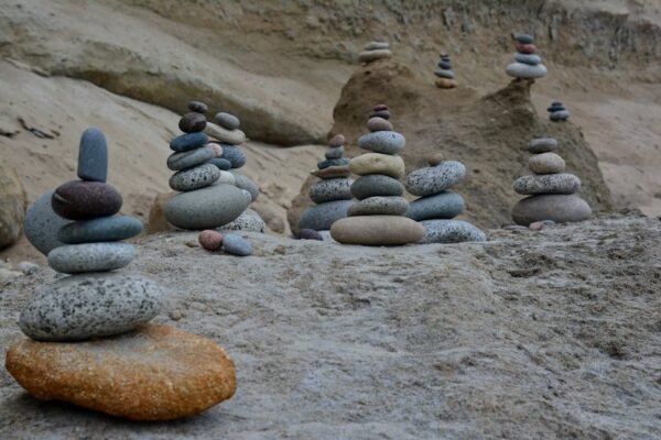 Beach Scenery - Tranquil scene of balanced stone stacks on a roc #26752990