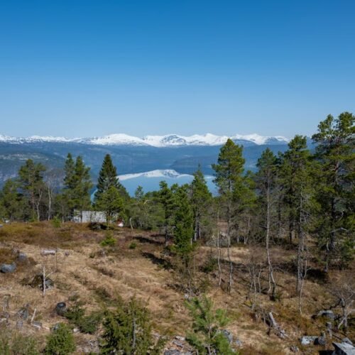 Lake Reflections - Beautiful view of Olden, Norway with snow-capped #26952921