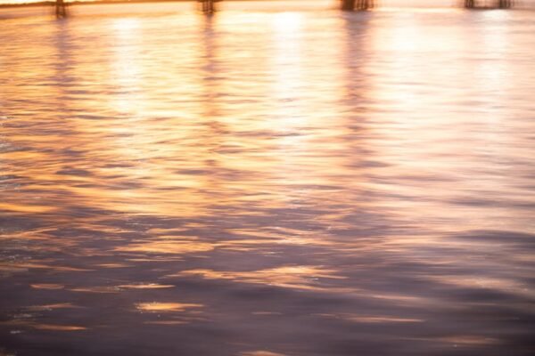 Lake Reflections - Golden sunset light reflecting on tranquil water #27935406