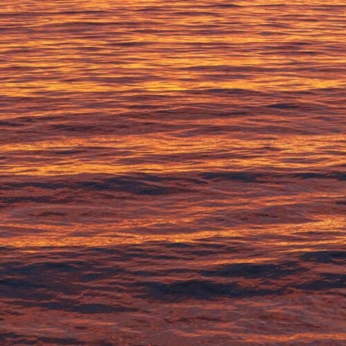Beach Scenery - Stunning golden sunset reflecting on ocean waves #28244912
