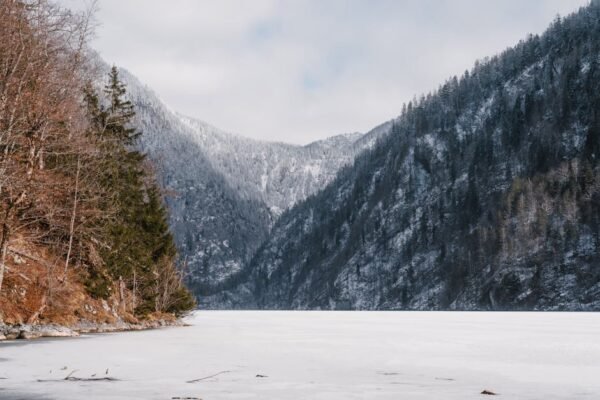 Lake Reflections - A peaceful winter scene featuring snowy mountain #31166672