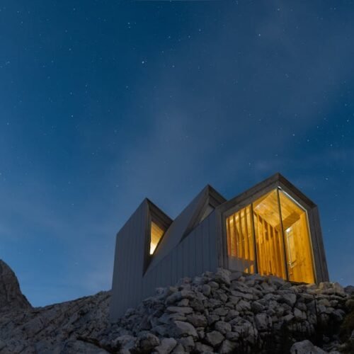 Beach Scenery - Contemporary cabin illuminated against a starry  #3312671