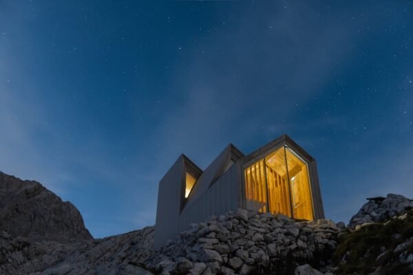 Beach Scenery - Contemporary cabin illuminated against a starry  #3312671