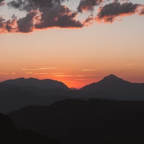 Mountain Landscapes - A tranquil view of mountain silhouettes against  #33889462