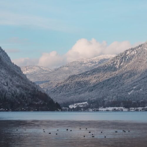 Lake Reflections - Serene winter landscape of a snow-covered mounta #35224233