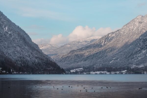 Lake Reflections - Serene winter landscape of a snow-covered mounta #35224233