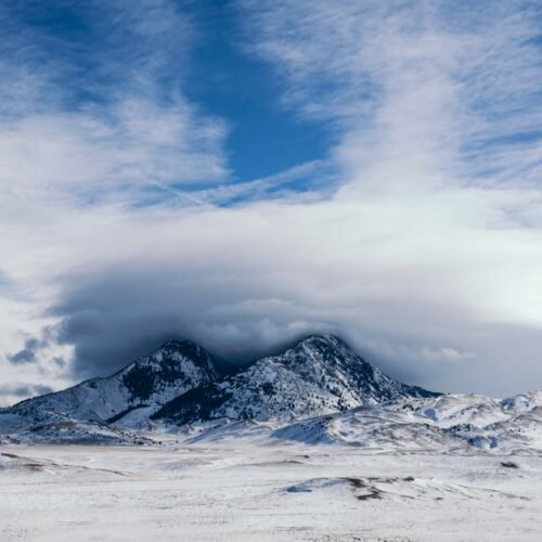 Snow Mountains - Majestic snow-covered mountains beneath a dramat #3555762