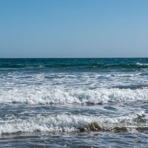 Beach Scenery - A tranquil ocean scene with gentle waves and a c #4050715