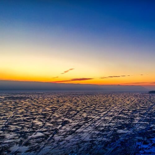 Lake Reflections - A breathtaking aerial view of a frozen lake at s #7929568