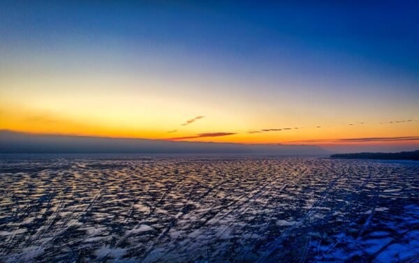 Lake Reflections - A breathtaking aerial view of a frozen lake at s #7929568