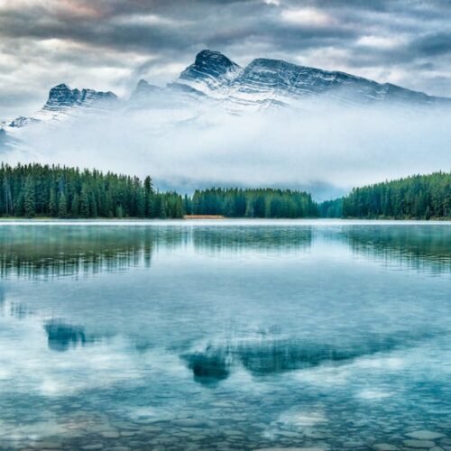 Snow Mountains - Stunning view of mountain reflection in Alberta' #8558891