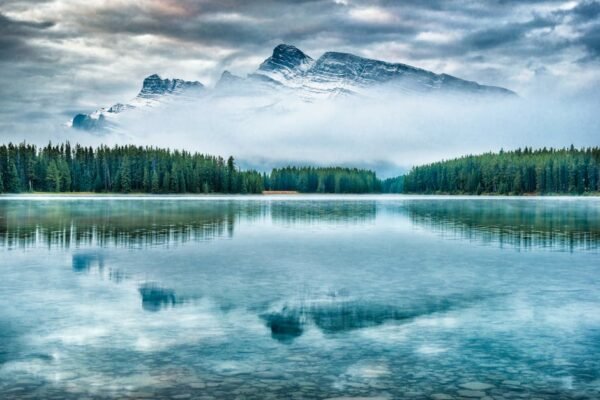 Snow Mountains - Stunning view of mountain reflection in Alberta' #8558891